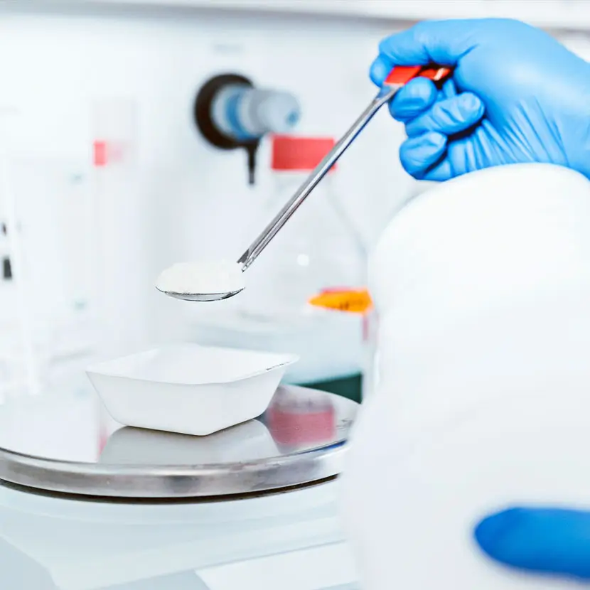 Medical powder being weighed on a pharmaceutical scale